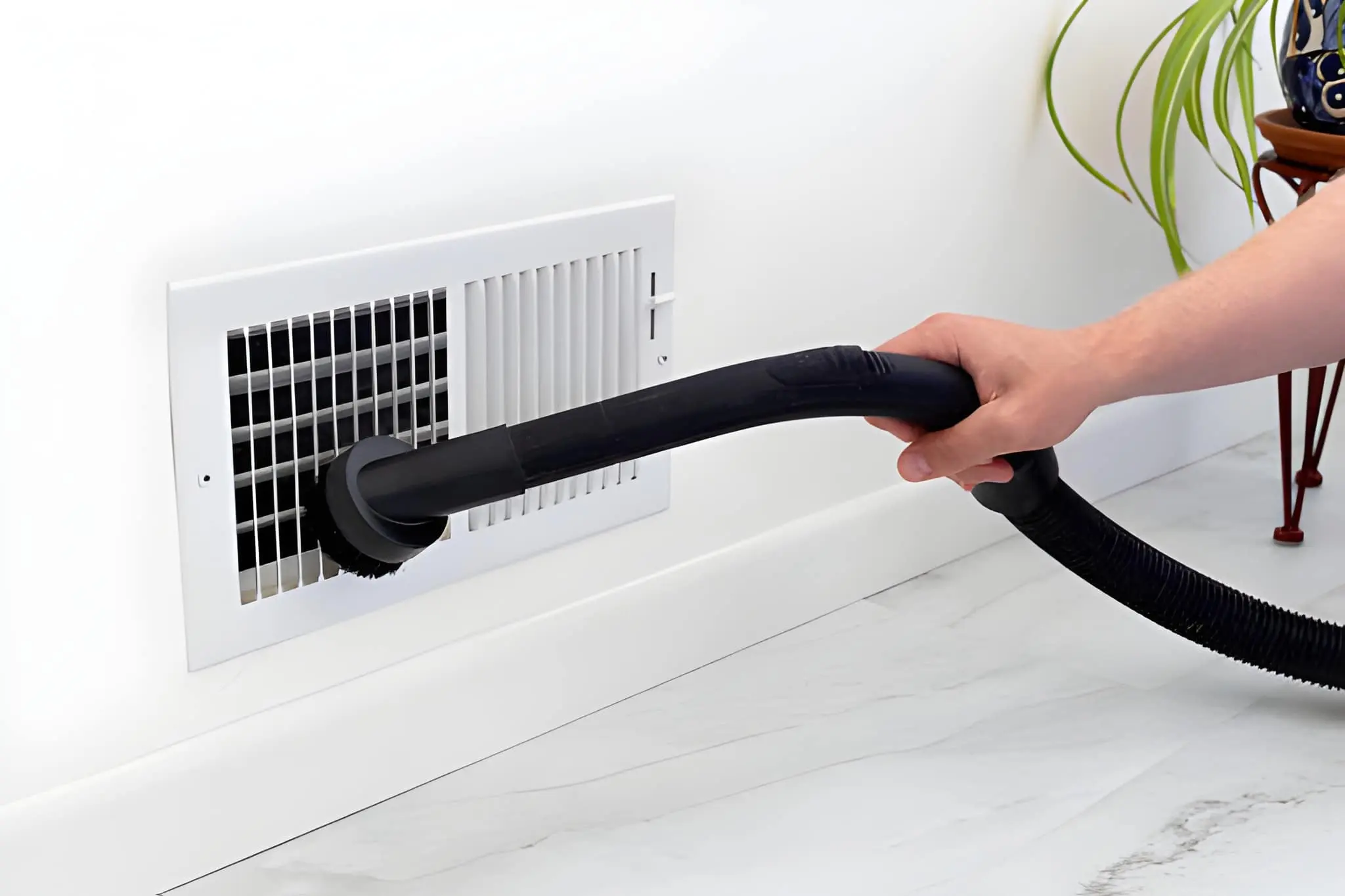 Professional AC Vent Cleaning removing dust and debris from home HVAC system vents